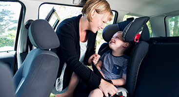 Mother with child in car 375x200